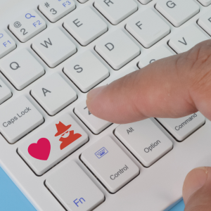 Keyboard with heart and scammer icon added